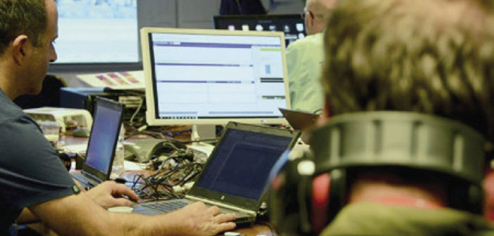 Test engineers at desks