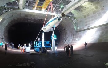 Arnold Engineering Development Complex team members lower the NASA/Army Tiltrotor Test Rig into the 40- by 80-ft wind tunnel in the AEDC National Full-Scale Aerodynamics Complex at Moffett Field in Mountain View, California