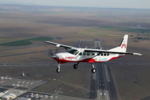 The Cessna 208B Grand Caravan retrofitted with the 750hp Magni500 propulsion system (inset) by AeroTEC during its first flight in May 2020