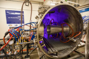 Arc-jet hypersonic tunnels, such as this one at the University of Texas Arlington, flow super hot air past test objects to simulate friction at hypersonic speeds