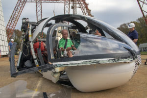 Crash test dummies can be seen seated in the vehicle after suffering a severe crash. The vehicle was destroyed beyond expectations which gives researchers valuable data when planning to make AAM vehicles safe for public use. Credits: Dave Bowman
