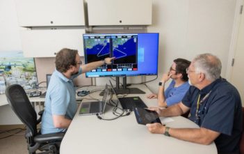 working on a flight plan at a computer